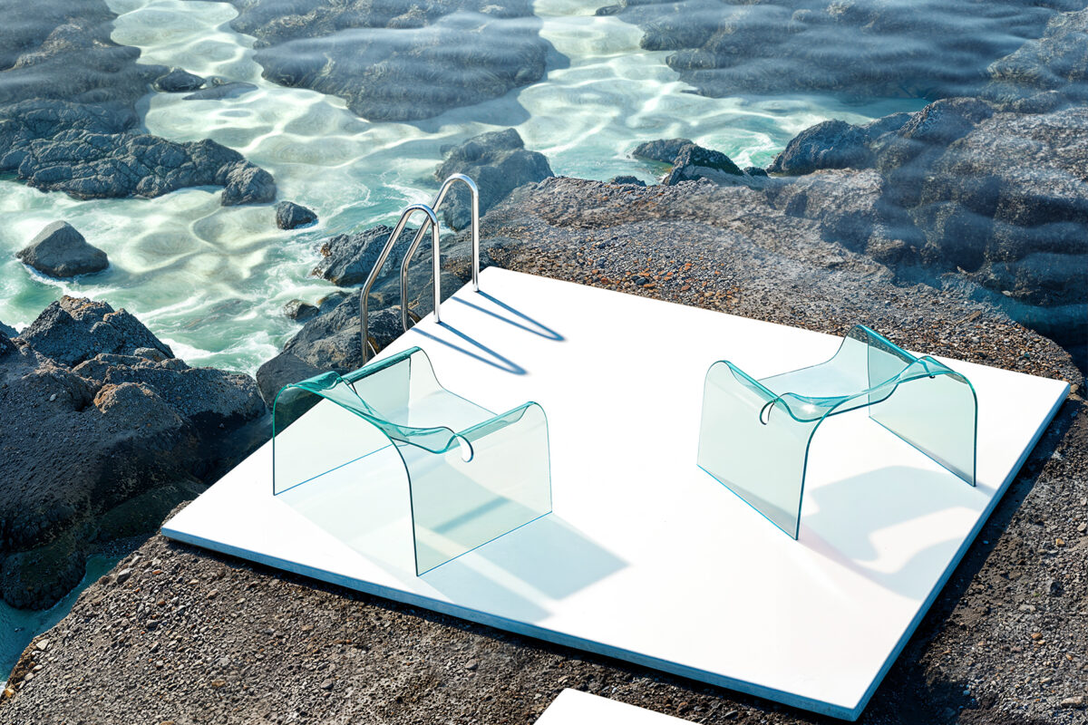 digital art cgi set design minimalista con poltrone in vetro trasparente ghost fiam cini boeri su piattaforma bianca affacciata su scogliera e mare cristallino laura farina